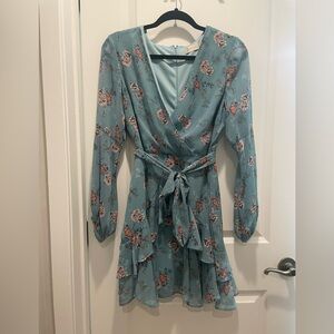 Cute above the knee long sleeve dress.  Size M